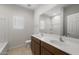 Bathroom featuring double sinks with generous counter space and tiled floors at 17776 W Getty Dr, Goodyear, AZ 85338