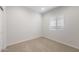 Inviting carpeted bedroom filled with natural light from a window at 17776 W Getty Dr, Goodyear, AZ 85338