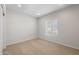 Inviting carpeted bedroom filled with natural light from window at 17776 W Getty Dr, Goodyear, AZ 85338