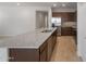 Stylish kitchen featuring a spacious granite island, stainless steel appliances, and modern cabinetry for a functional and attractive cooking area at 17776 W Getty Dr, Goodyear, AZ 85338