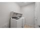 Functional laundry room featuring modern appliances, and ample space at 17776 W Getty Dr, Goodyear, AZ 85338