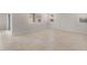 Open living space with tile floors and natural light from multiple windows at 17776 W Getty Dr, Goodyear, AZ 85338