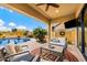 Covered patio featuring comfortable seating, views of the pool, and serene backyard landscaping at 1829 N Atwood --, Mesa, AZ 85207