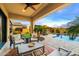 Outdoor patio area with comfortable seating, lush landscaping, and a sparkling pool, ideal for entertaining at 1829 N Atwood --, Mesa, AZ 85207