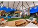This backyard features a covered patio, dining and living space, outdoor kitchen and beautiful landscaping, making it an oasis at 1829 N Atwood --, Mesa, AZ 85207