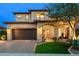 Inviting two-story home boasts a desert landscape, brick driveway, and an attached two-car garage at 1829 N Atwood --, Mesa, AZ 85207