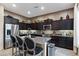 Modern kitchen boasts granite countertops, stainless appliances, and stylish breakfast bar seating at 1829 N Atwood --, Mesa, AZ 85207