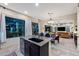 Bright kitchen with granite island offers seating, ample light, and an open-concept design at 1829 N Atwood --, Mesa, AZ 85207