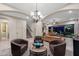 Spacious living room features elegant chandelier, staircase, and comfortable seating with an open floor plan at 1829 N Atwood --, Mesa, AZ 85207