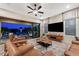 Cozy living room showcasing modern TV, comfortable seating, and access to the outdoor pool area at 1829 N Atwood --, Mesa, AZ 85207