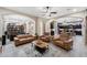 Open-concept living room with tile flooring, modern furnishings, and seamless flow to other spaces at 1829 N Atwood --, Mesa, AZ 85207