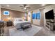 Well-lit main bedroom with patterned wallpaper, carpet, and ample natural light at 1829 N Atwood --, Mesa, AZ 85207