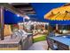 Outdoor kitchen with stainless steel grill, pergola, dining and seating area are ideal for backyard barbecues and relaxing at 1829 N Atwood --, Mesa, AZ 85207
