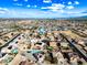 Aerial view of a residential neighborhood featuring solar panels and well-maintained properties at 1849 S 225Th Dr, Buckeye, AZ 85326