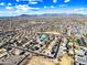 Aerial view of a residential neighborhood, showcasing well-maintained homes, streets and lush backyard swimming pools at 1849 S 225Th Dr, Buckeye, AZ 85326