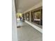 Long covered patio featuring concrete flooring and views of the backyard at 1849 S 225Th Dr, Buckeye, AZ 85326