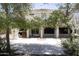 Spacious backyard featuring mature trees, a covered patio, and ample room for outdoor entertaining at 1849 S 225Th Dr, Buckeye, AZ 85326