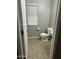 Cozy half bathroom featuring tile floors, neutral paint, and updated fixtures at 1849 S 225Th Dr, Buckeye, AZ 85326