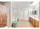 Bright bathroom features double sinks, tiled floors, shower and bath at 1849 S 225Th Dr, Buckeye, AZ 85326