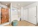 Bathroom featuring a tub and shower with decorative glass doors at 1849 S 225Th Dr, Buckeye, AZ 85326