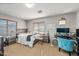 Comfortable bedroom featuring a wood-frame bed, coordinating furniture, soft carpet, and bright window at 1849 S 225Th Dr, Buckeye, AZ 85326