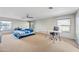 Large bedroom with carpeted floors, a ceiling fan, and two windows offering natural light at 1849 S 225Th Dr, Buckeye, AZ 85326