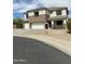 Attractive two-story home with a three-car garage and well-maintained landscaping at 1849 S 225Th Dr, Buckeye, AZ 85326