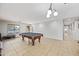 Bright room featuring a classic pool table and easy access to the entryway at 1849 S 225Th Dr, Buckeye, AZ 85326