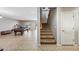 Spacious game room with tile floors, pool table, and easy access to the stairway at 1849 S 225Th Dr, Buckeye, AZ 85326