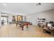 Spacious game room featuring a pool table and tiled floors at 1849 S 225Th Dr, Buckeye, AZ 85326