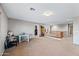 Spacious loft area with carpeted flooring and abundant natural light at 1849 S 225Th Dr, Buckeye, AZ 85326