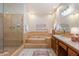 Bathroom featuring tile shower, bathtub, vanity, and light fixtures at 1905 N Calle Maderas --, Mesa, AZ 85213