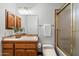 Bathroom with a tiled vanity, toilet, shower, and fixtures at 1905 N Calle Maderas --, Mesa, AZ 85213