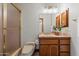Bathroom featuring a toilet, tiled shower, vanity, and fixtures at 1905 N Calle Maderas --, Mesa, AZ 85213