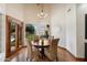 Cozy dining area features wood floors, a round table with seating, and views of the outdoors at 1905 N Calle Maderas --, Mesa, AZ 85213
