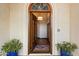 Grand entryway featuring a stained glass window above a wooden front door and views into the home at 1905 N Calle Maderas --, Mesa, AZ 85213
