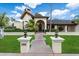 Inviting entrance with meticulously maintained landscaping leading to the front door of the home at 1905 N Calle Maderas --, Mesa, AZ 85213