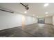 Spacious garage with concrete floors and multiple light fixtures at 1905 N Calle Maderas --, Mesa, AZ 85213
