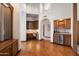 Elegant hallway featuring a built-in desk, bar area, and views of the open floor plan at 1905 N Calle Maderas --, Mesa, AZ 85213