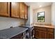 Laundry room with new appliances, tile countertop, and window at 1905 N Calle Maderas --, Mesa, AZ 85213