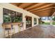 Outdoor patio with tile floor, wood beams, and bar seating area at 1905 N Calle Maderas --, Mesa, AZ 85213