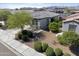 Aerial view of a single-story home featuring desert landscaping in a quiet neighborhood on a sunny day at 19984 W Washington St, Buckeye, AZ 85326