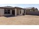 Spacious backyard with a covered patio, perfect for outdoor entertaining and relaxation at 19984 W Washington St, Buckeye, AZ 85326