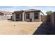 Spacious backyard with a covered patio, perfect for outdoor entertaining and relaxation at 19984 W Washington St, Buckeye, AZ 85326