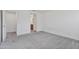 An empty bedroom features plush carpet at 19984 W Washington St, Buckeye, AZ 85326