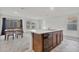 Kitchen island features granite countertop and stainless steel sink at 19984 W Washington St, Buckeye, AZ 85326