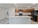A kitchen showcasing granite countertops, wood cabinets, and a large island at 19984 W Washington St, Buckeye, AZ 85326