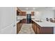 An open-concept kitchen boasts stainless appliances, modern cabinets, and an island at 19984 W Washington St, Buckeye, AZ 85326