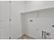 Practical laundry room with essential connections, offering convenience for laundry tasks at 19984 W Washington St, Buckeye, AZ 85326
