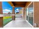 Covered back patio offers a great space to relax and enjoy views of the landscaped backyard at 20116 W Monroe St, Buckeye, AZ 85326